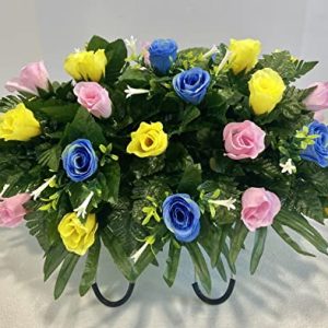 cemetery headstone saddle arrangement with pink blue and yellow roses with white accent grave decoration 0