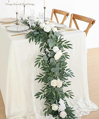 Silky Flower Store Artificial Eucalyptus Garland with Flowers, Ivory White Table Decor, 6ft, 13.75 x 3.5in 7 7 Product: Floroom 6ft Artificial Eucalyptus Garland with Flowers Fake Greenery Faux Floral Vine Garland for Table Decor Wedding Centerpieces Bridal Shower Party Decorations, Ivory White
