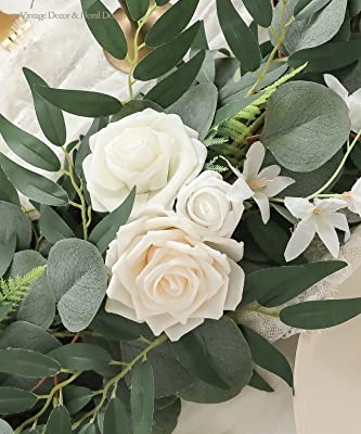 Silky Flower Store Artificial Eucalyptus Garland with Flowers, Ivory White Table Decor, 6ft, 13.75 x 3.5in 11 11 Product: Floroom 6ft Artificial Eucalyptus Garland with Flowers Fake Greenery Faux Floral Vine Garland for Table Decor Wedding Centerpieces Bridal Shower Party Decorations, Ivory White