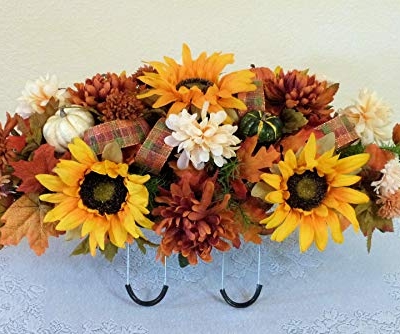 Silky Flower Store Fall Cemetery Saddle Artificial Grave Flowers, Sunflowers Pumpkins, UV Waterproof Silk Florals, 27 x 14 x 10 inches 9 9 Product: Silk Florals & Frills Fall Cemetery Saddle with Pumpkins and Sunflowers, Fall Grave Headstone Flowers